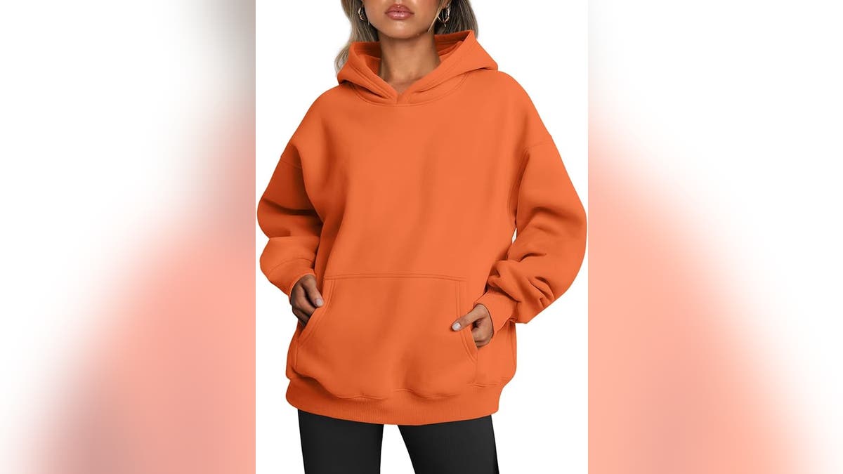 Turn a simple orange sweatshirt into a jack-o-lantern costume.