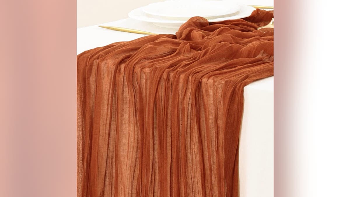 This orange tablecloth is the ideal addition to any Thanksgiving table.