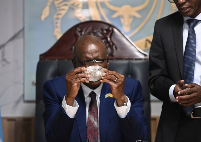 President Masses holds a diamond