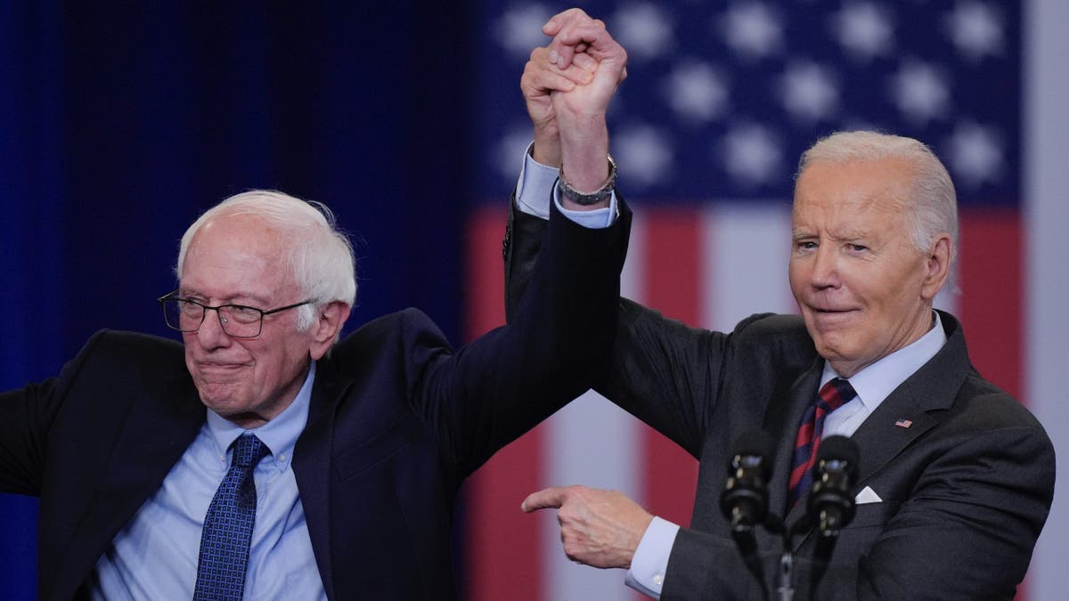 President Joe Biden with Sen. Bernie, D-Vt., after Biden delivered remarks on lowering the cost of prescription drugs, at NHTI Concord Community College, Tuesday, Oct. 22, 2024, in Concord, N.H.. (AP Photo/Steven Senne)