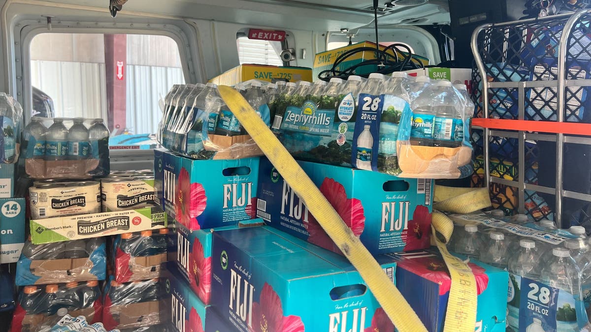 bottles of water and other hurricane relief supplies in helicopter