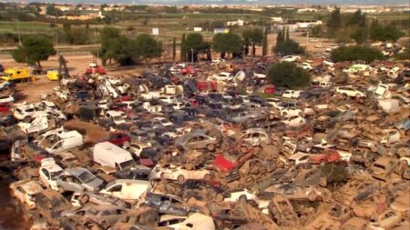 Car graveyard reminder of scale of Spain's devastating flooding