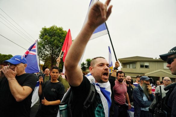 A man draped in an Israeli flag on Inkerman Road on Monday night.