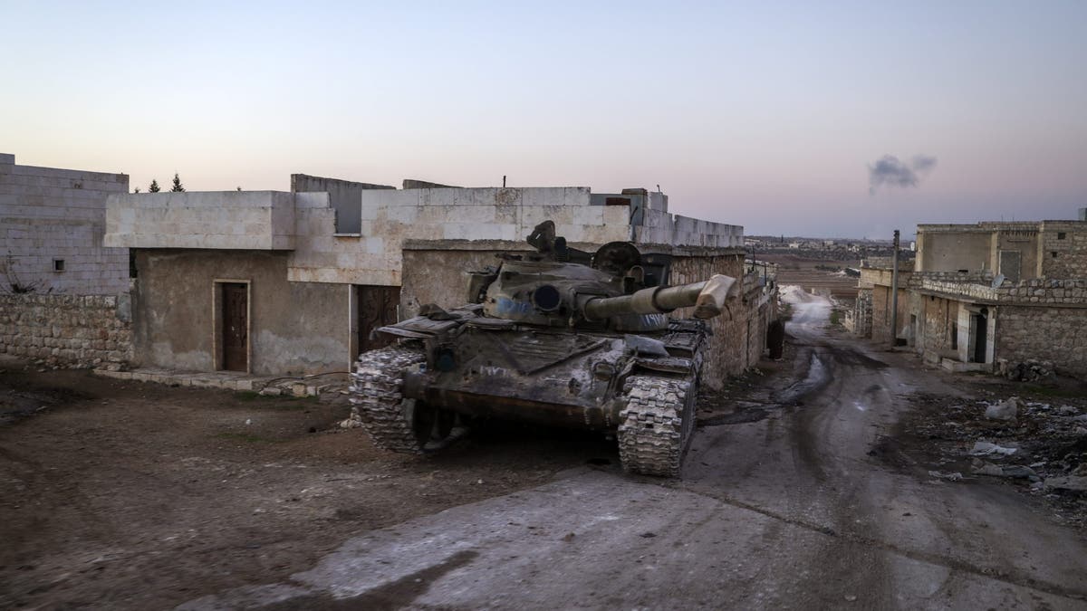 A destroyed Syrian army tank sits in the village of Anjara, western outskirts of Aleppo, Syria, Thursday Nov. 28, 2024.