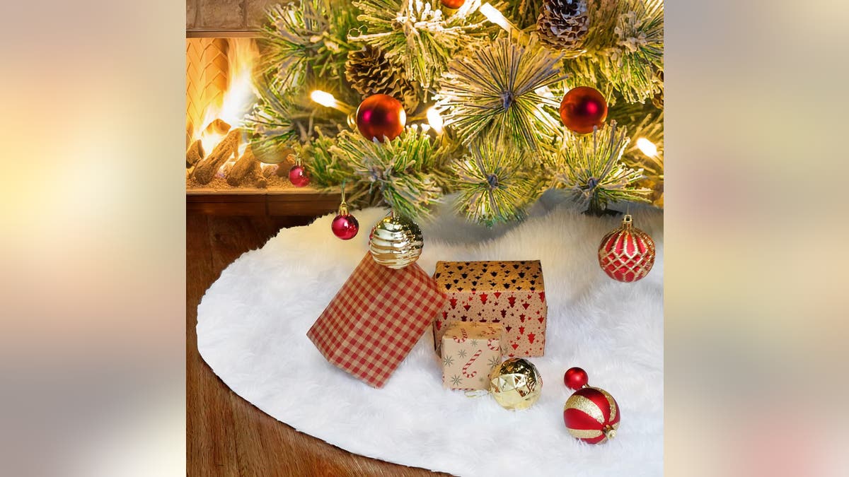 Update your tree with this 48-inch Faux Fur White Christmas tree skirt.