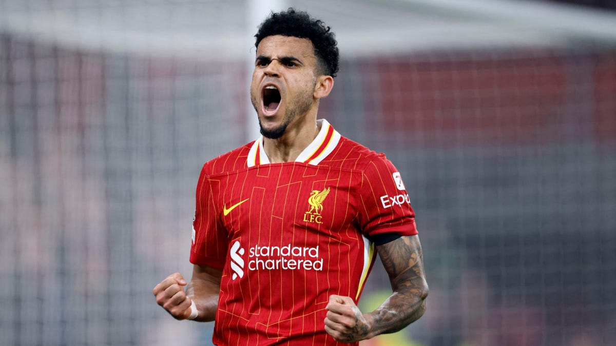 Luis Diaz of Liverpool celebrating, shouting, with both hands clenched.