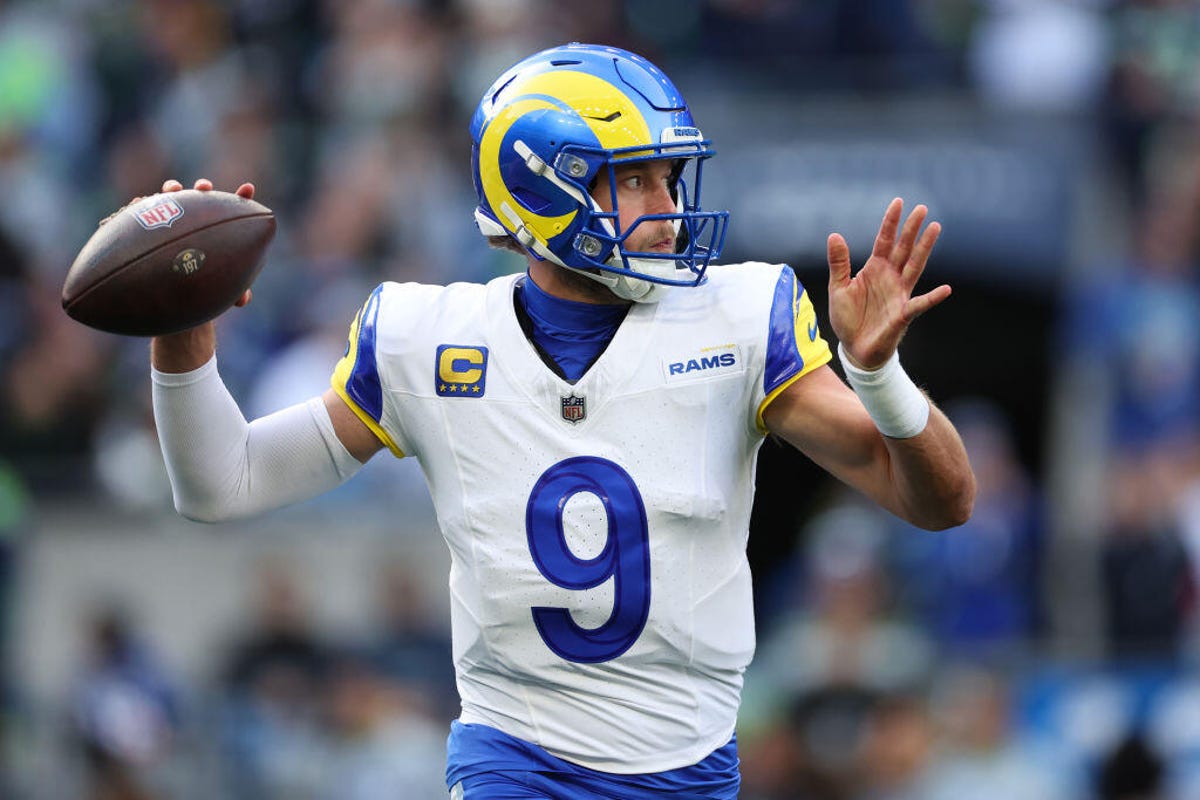 Quarterback Matthew Stafford #9 of the Los Angeles Rams throws a pass during the first quarter against the Seattle Seahawks at Lumen Field