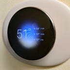 Google Nest Learning Thermostat (4th gen) showing current temperatures outside