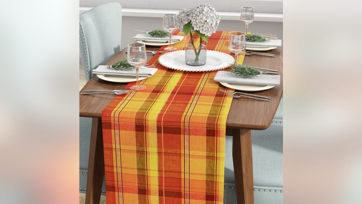 Outfit your table with a fall-themed tablecloth.