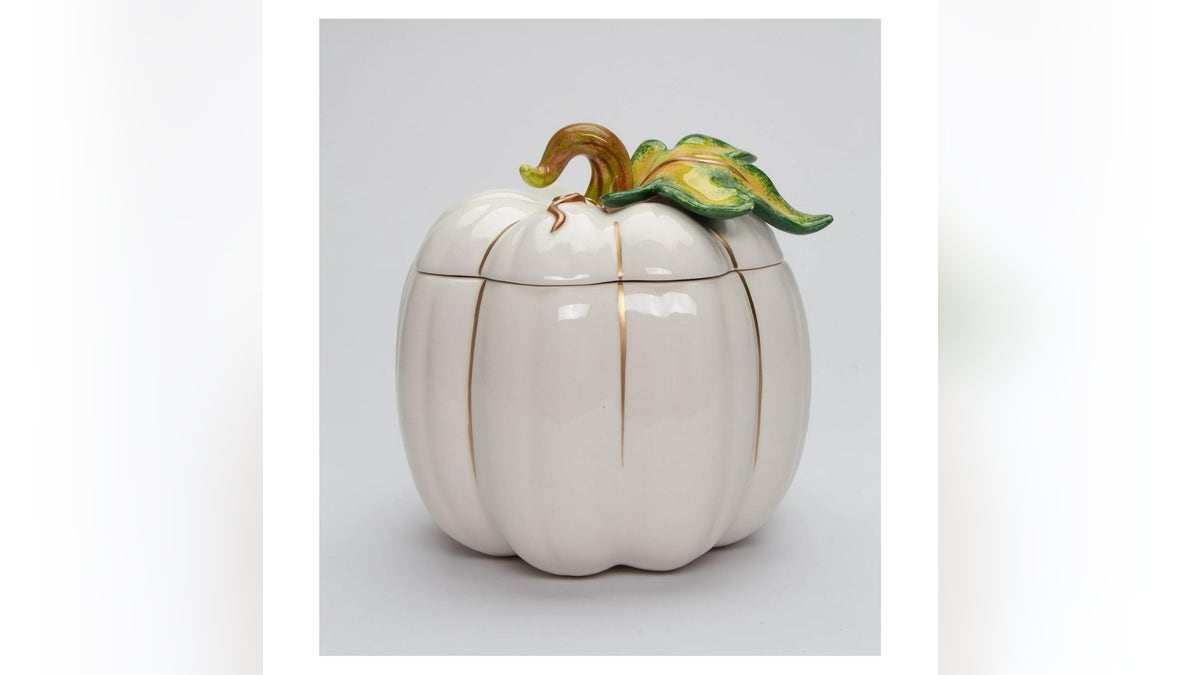 A festive yet practical ceramic pumpkin cookie jar adds a touch of charm to your countertop.