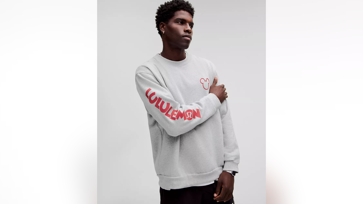 A trendy, comfortable crew neck featuring a small Mickey outline.