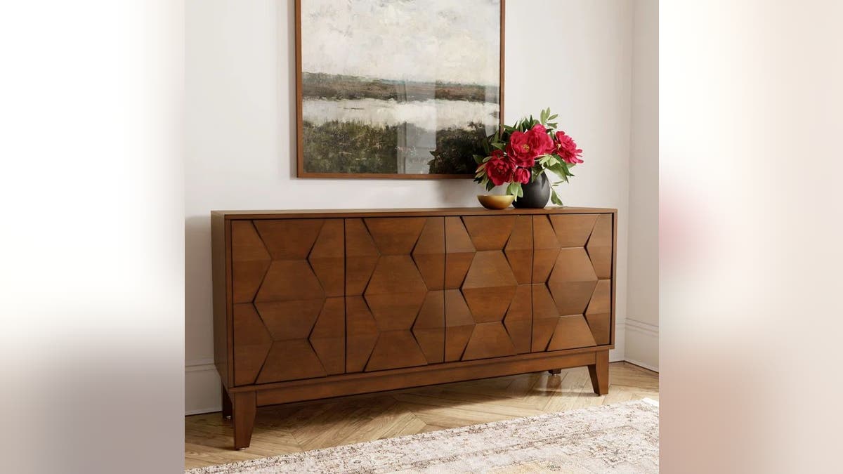 Put this elegantly crafted sideboard in your living room.