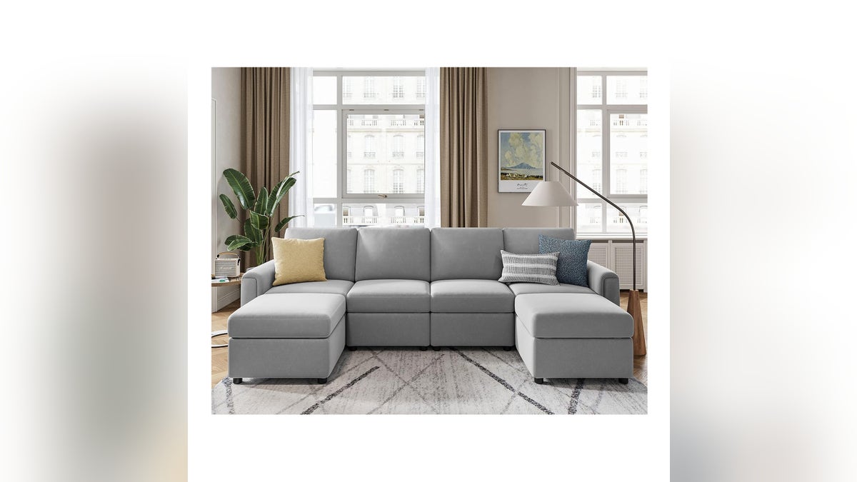 A comfy couch with plenty of storage.