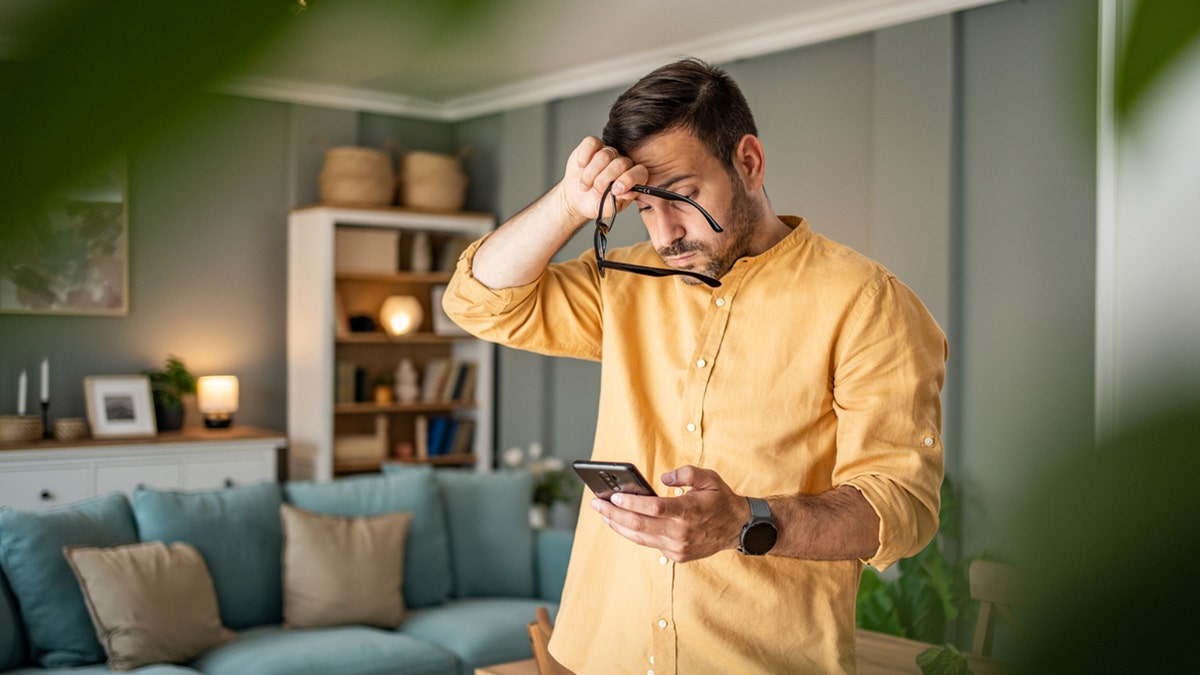 man upset on the phone