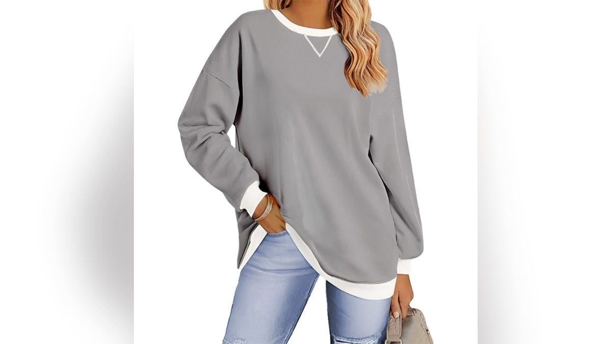Stay cozy with an oversized sweatshirt.