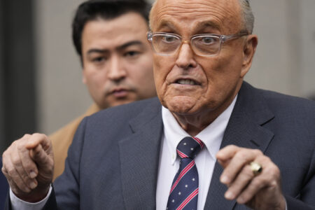 Rudy Giuliani Hawks Rudy Coffee While Dressed as Santa Amid Legal Woes
