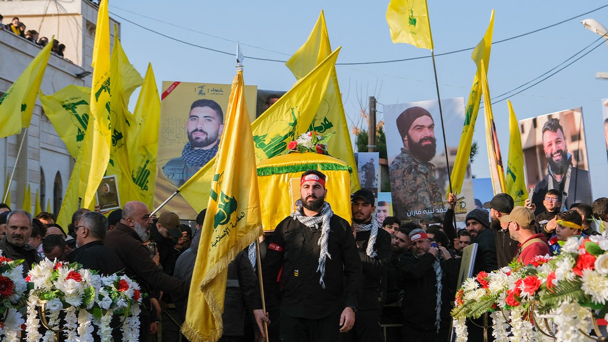 Mourners react during the funeral of Hezbollah member Hassan Ghassan Hijazi, who was killed by an Israeli strike in Tayr Debba, in southern Lebanon, January 11, 2025.