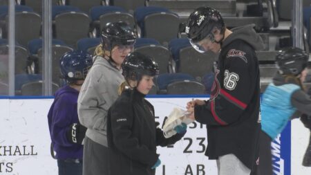 Alberta Motor Association safety patrollers skate with Lethbridge Hurricanes