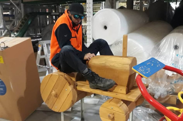 Keast, horsing around on a piece of playground equipment.