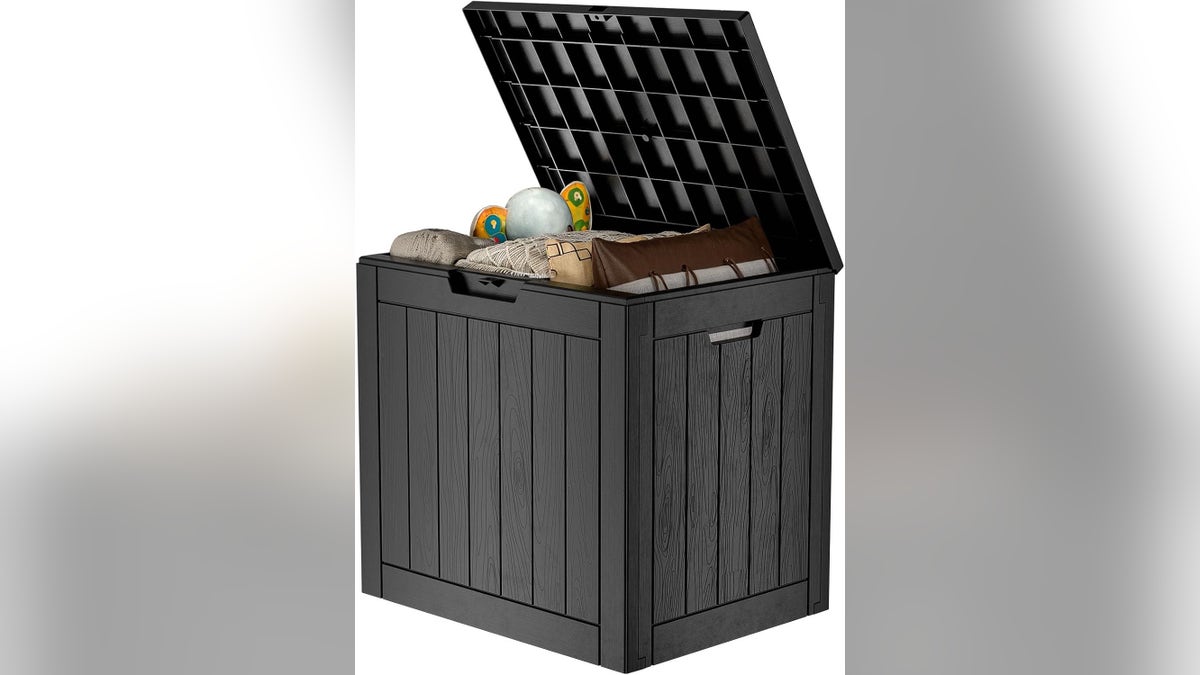 Cozy fire pit blankets are safely stored in this resin deck box.