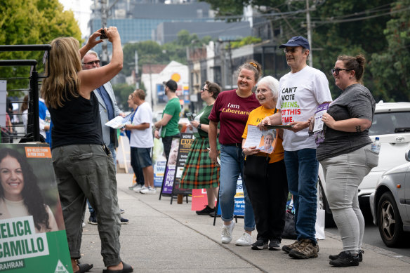 Supporters of independent candidates outside South Yarra Library.
