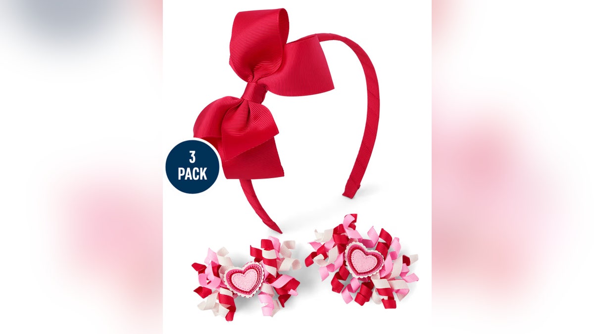 This 3-piece Gymboree set featuring heart headbands and festive barrettes is a simple way to add Valentine’s flair without committing to a full outfit.