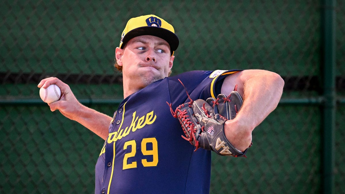 Trevor Megill throws a pitch