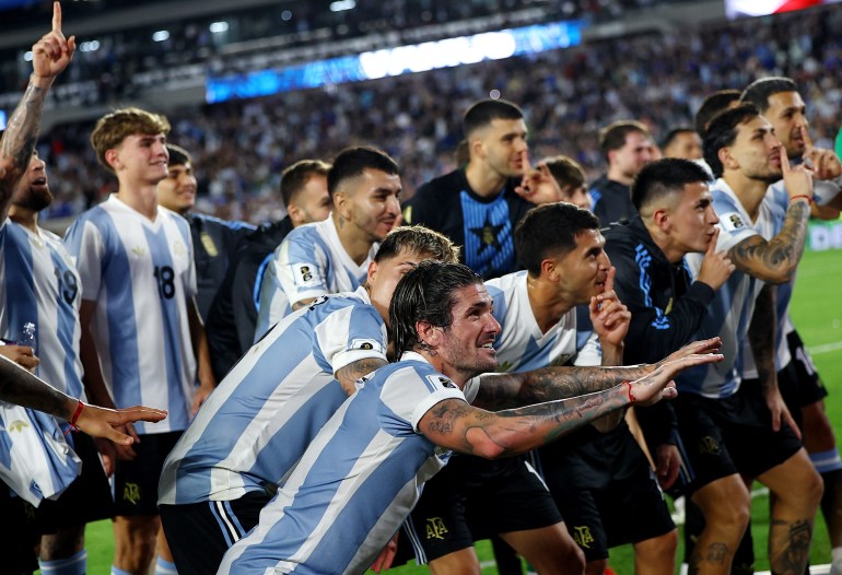 Soccer Football - World Cup - South American Qualifiers - Argentina v Brazil - Estadio Mas Monumental, Buenos Aires, Argentina - March 25, 2025 Argentina's Exequiel Palacios, Rodrigo De Paul, Enzo Paredes and Thiago Almada celebrate after qualify to the World Cup 2026 REUTERS/Agustin Marcarian