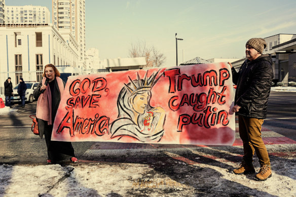 Protesters  against Trump’s administration outside the US embassy in Kyiv on February 26.
