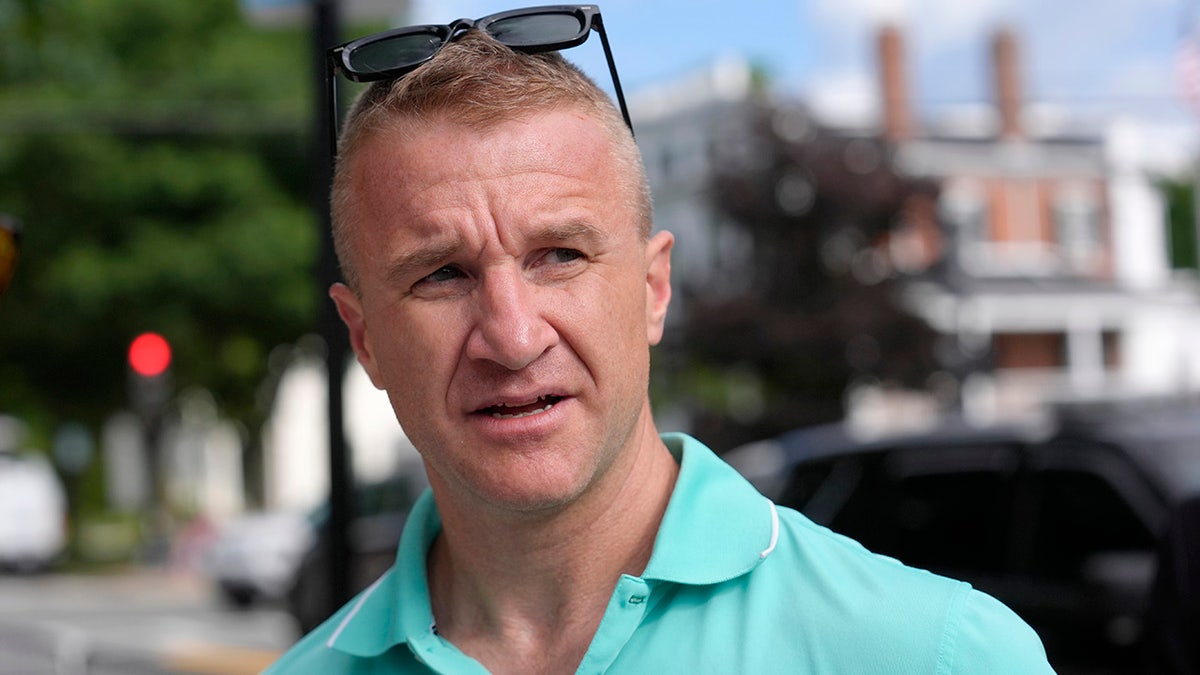 Aidan Timothy Kearney speaks with a reporter outside Norfolk Superior Court