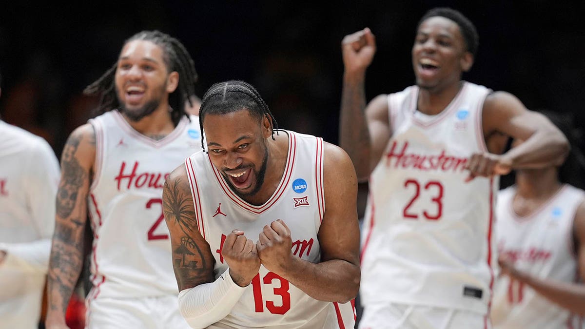 Houston basketball players celebrate