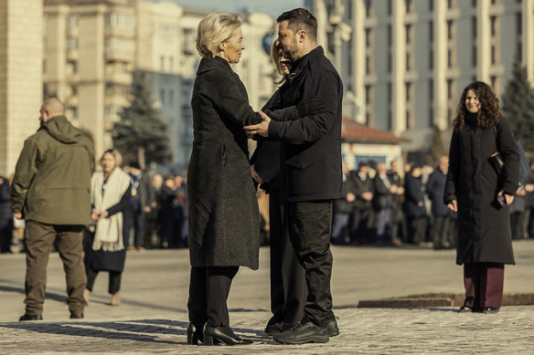 Ukraine’s President Volodymyr Zelensky, right, greets European Commission President Ursula von der Leyen during a ceremony in Kyiv in February. 

