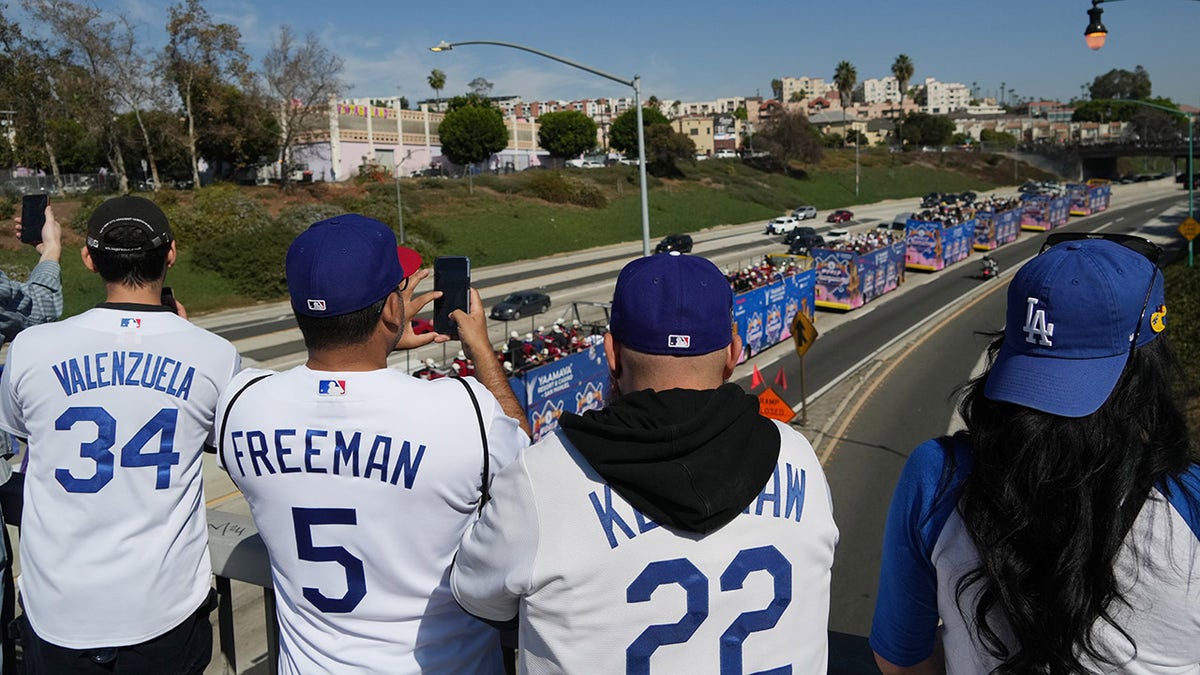 Dodgers fans watch the parade
