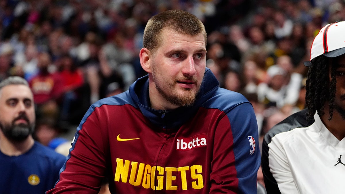Nikola Jokic sits on bench