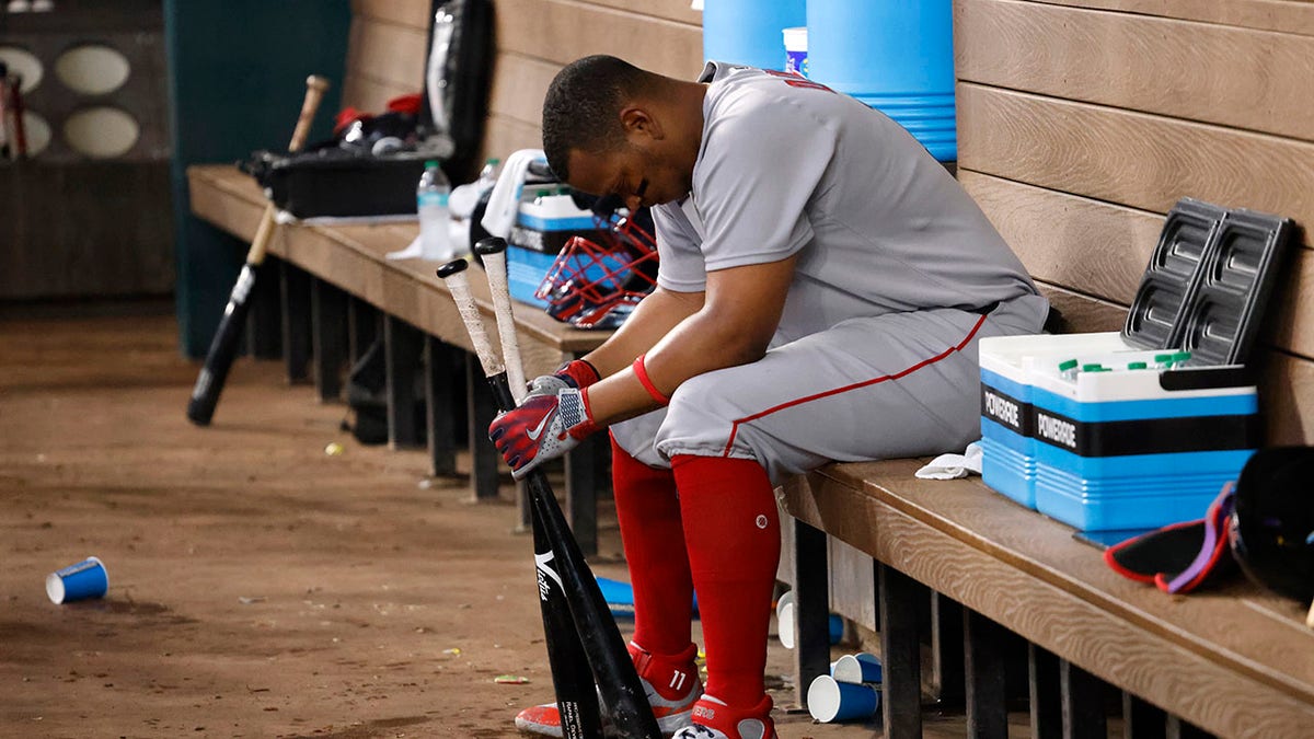 Rafael Devers sits in the dugout