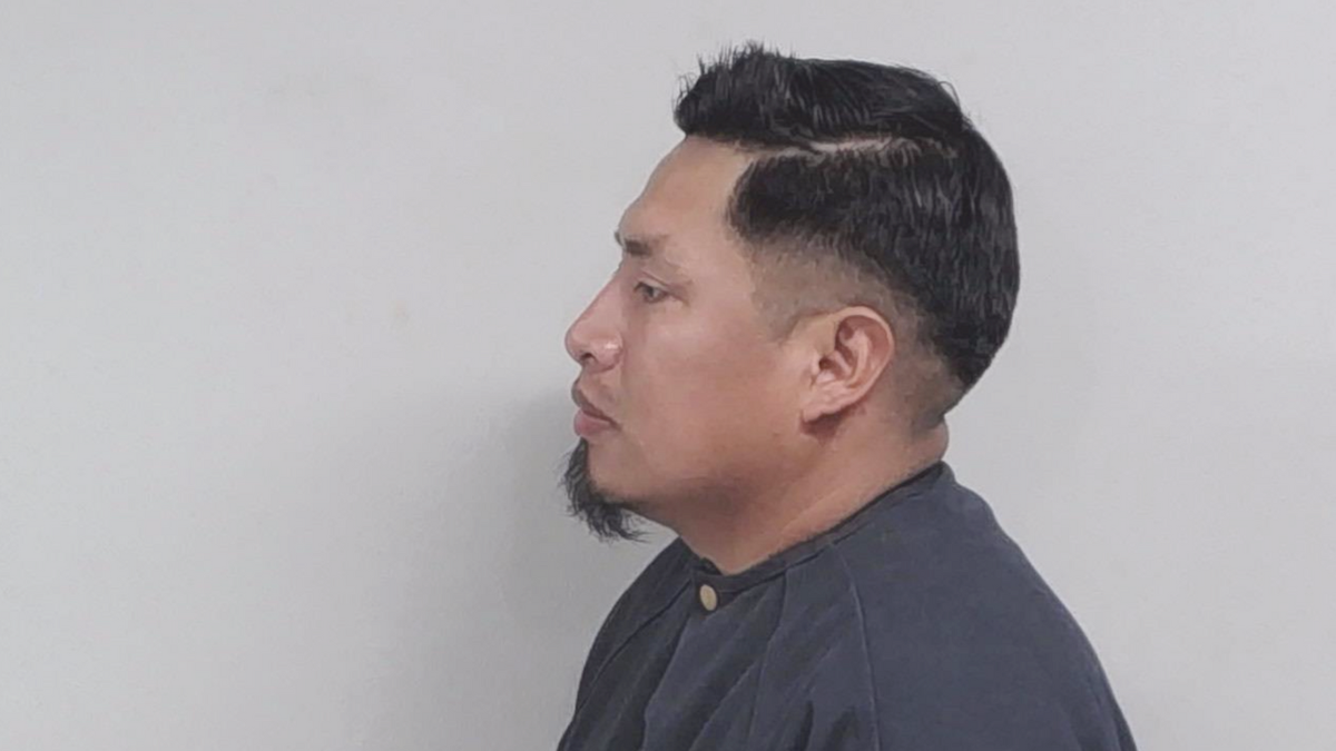 Nery Antonio Gonzalez faces sideways while posing for a booking picture.