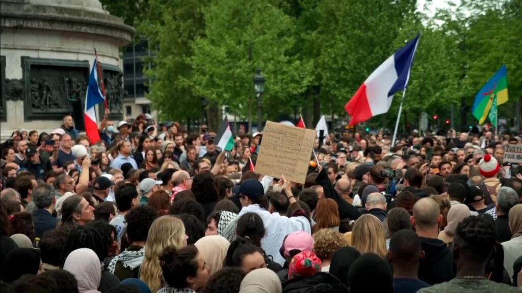 Hundreds gather in Paris as French Muslim community mourns death of man brutally killed in mosque