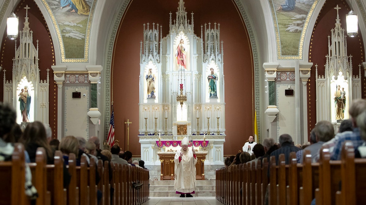 Archbishop Joseph Naumann leads mass in Kansas