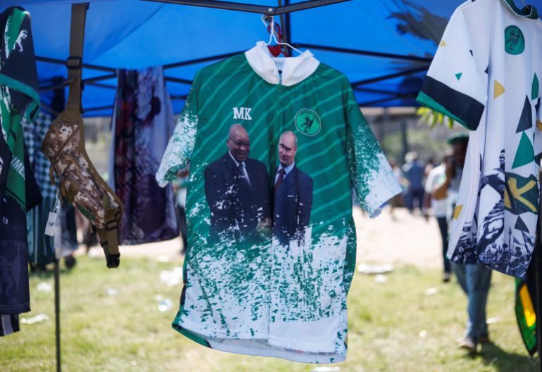 A stall sells an uMkhonto weSizwe Party branded T-shirt with the image of former South African President Jacob Zuma with Russian President Vladimir Putin outside the High Court in Durban, South Africa, March 27, 2024. REUTERS/Rogan Ward