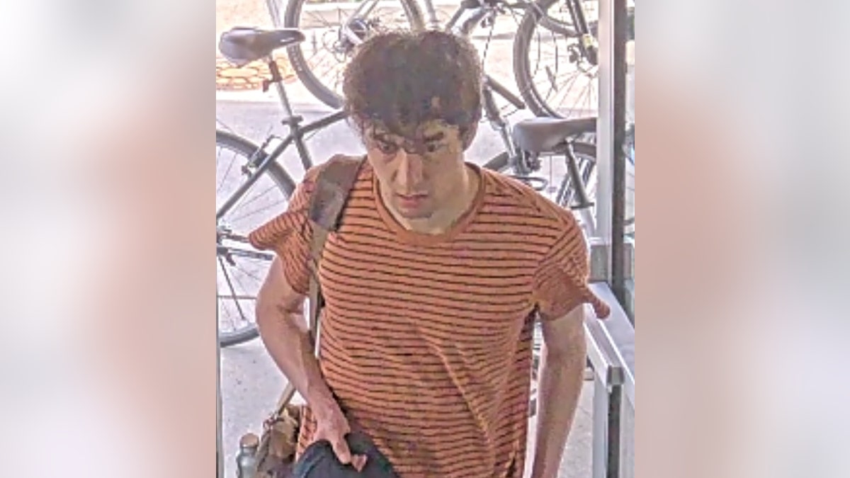 Blackburn seen in a yellow-orange t-shirt on surveillance footage