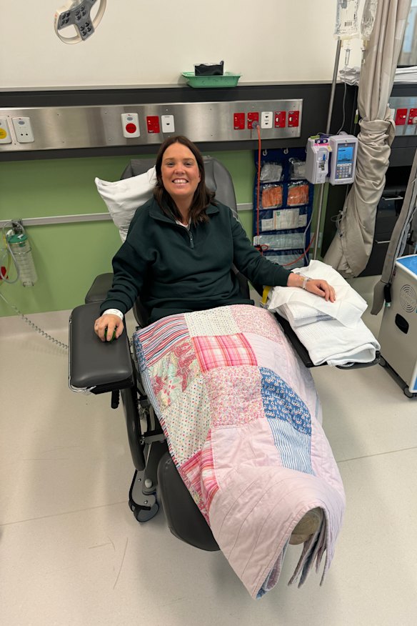 Lucy Ormonde (pictured at her first chemotherapy treatment) was “really glad” to have had 23 eggs frozen one month before she discovered she had breast cancer.