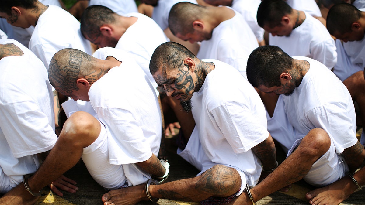 MS-13 gang members wait to be escorted at the maximum-security jail in Zacatecoluca, El Salvador