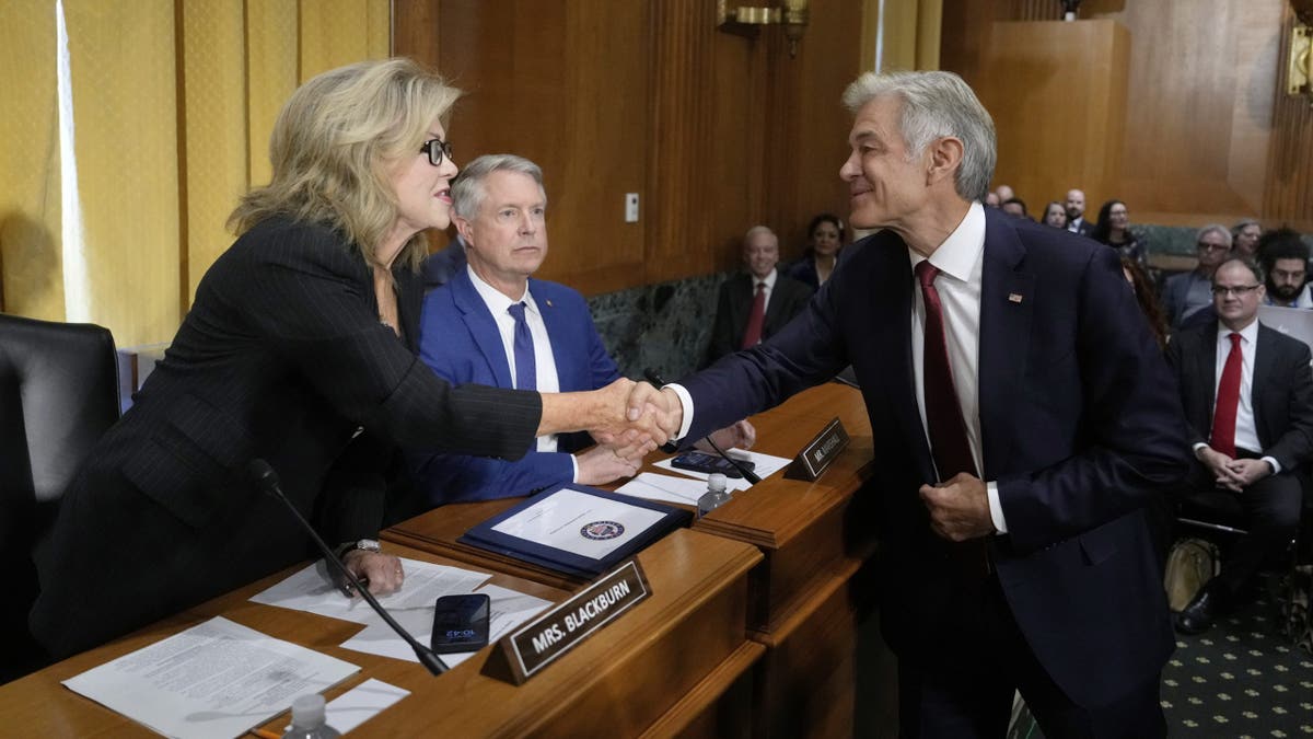 Dr. Mehmet Oz greets Sen. Marsha Blackburn, R-Tenn., as Sen. Roger Marshall, R-Kan., looks on before Oz testifies at his confirmation hearing before the Senate Finance Committee, on Capitol Hill in Washington, March 14, 2025. 