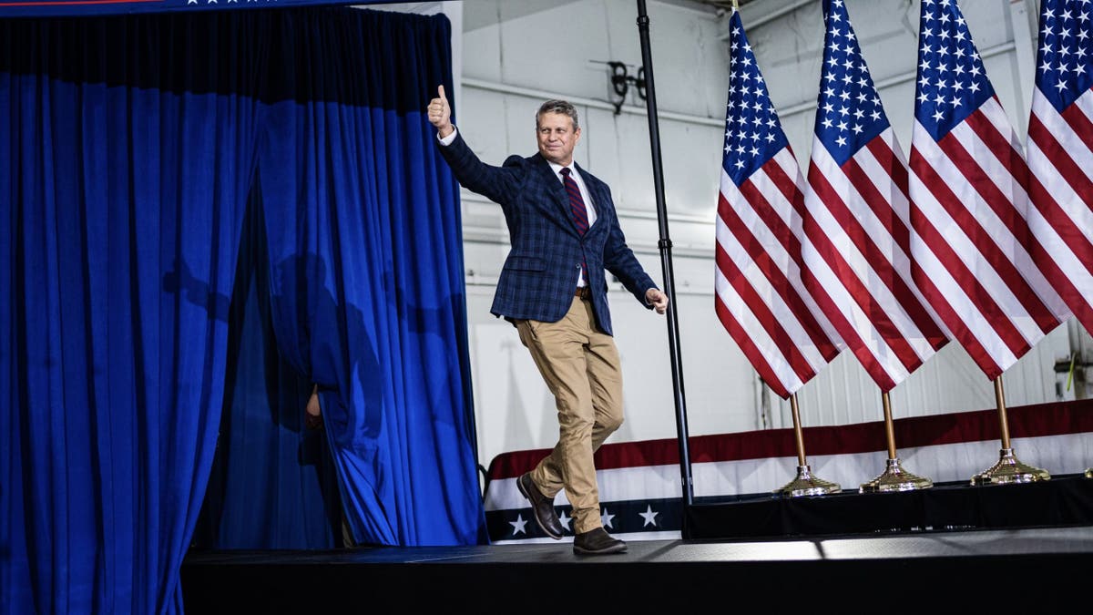 Republican Rep. Bill Huizenga of Michigan arrives at a campaign rally