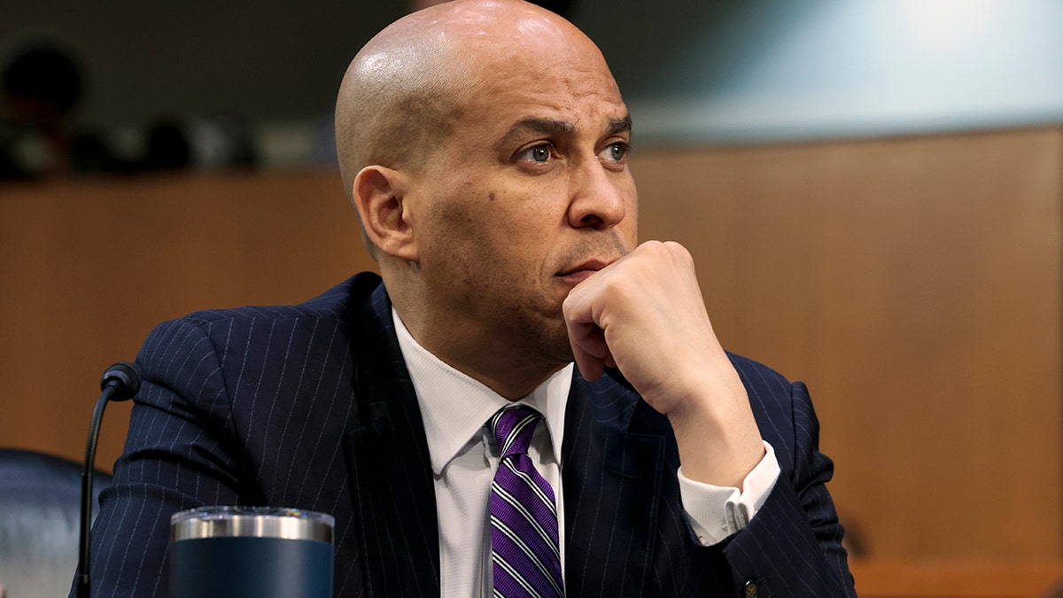 Sen. Cory Booker listens as U.S. Supreme Court nominee Judge Ketanji Brown Jackson testifies during her confirmation hearing before the Senate Judiciary Committee on March 22, 2022 in Washington.