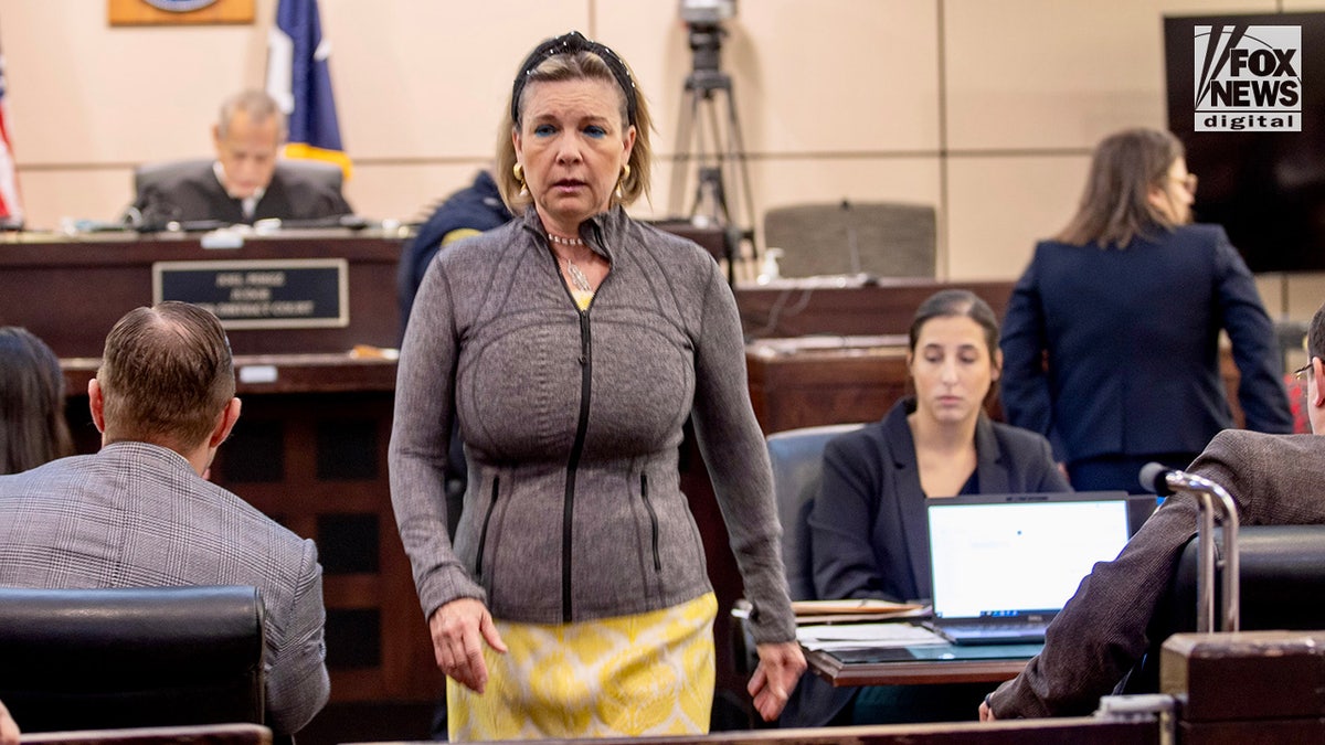 Teresa Clark, sister of Suzanne Simpson, walks away after addressing the court as Brad Simpson appears for a pre-trial hearing