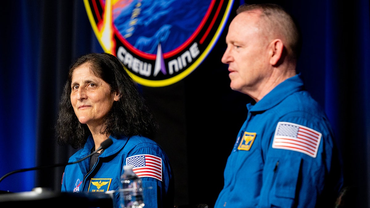 Sunita "Suni" Williams and Barry "Butch" Wilmore wear blue space suits