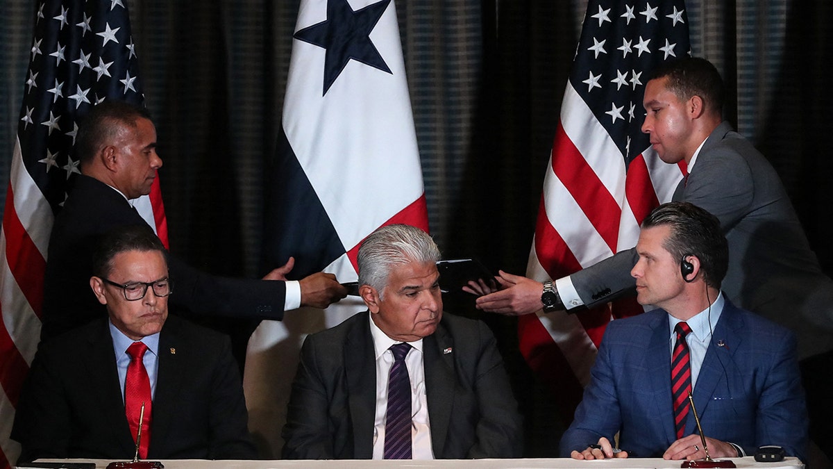 Panama's President Jose Raul Mulino looks on as Panama's Security Minister Frank Abrego and US Secretary of Defense Pete Hegseth