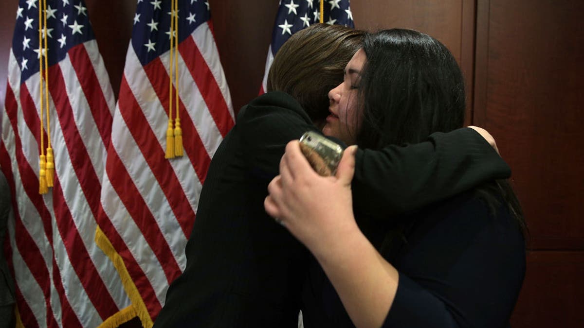 Greisa Martinez Rosas, right, hugs Sen. Catherine Cortez Masto, D-Nev., during a news conference on Capitol Hill on Feb. 16, 2017. (Alex Wong/Getty Images)