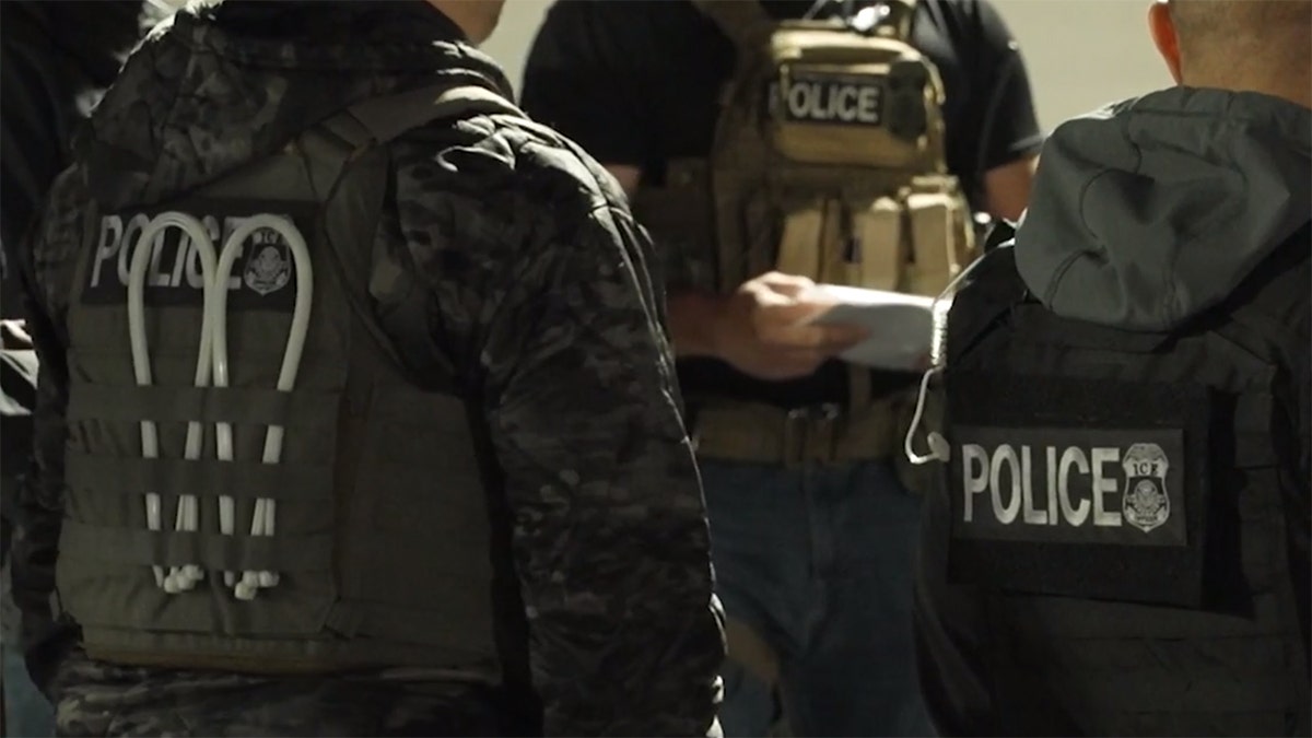 ICE agents in black, closeup shot